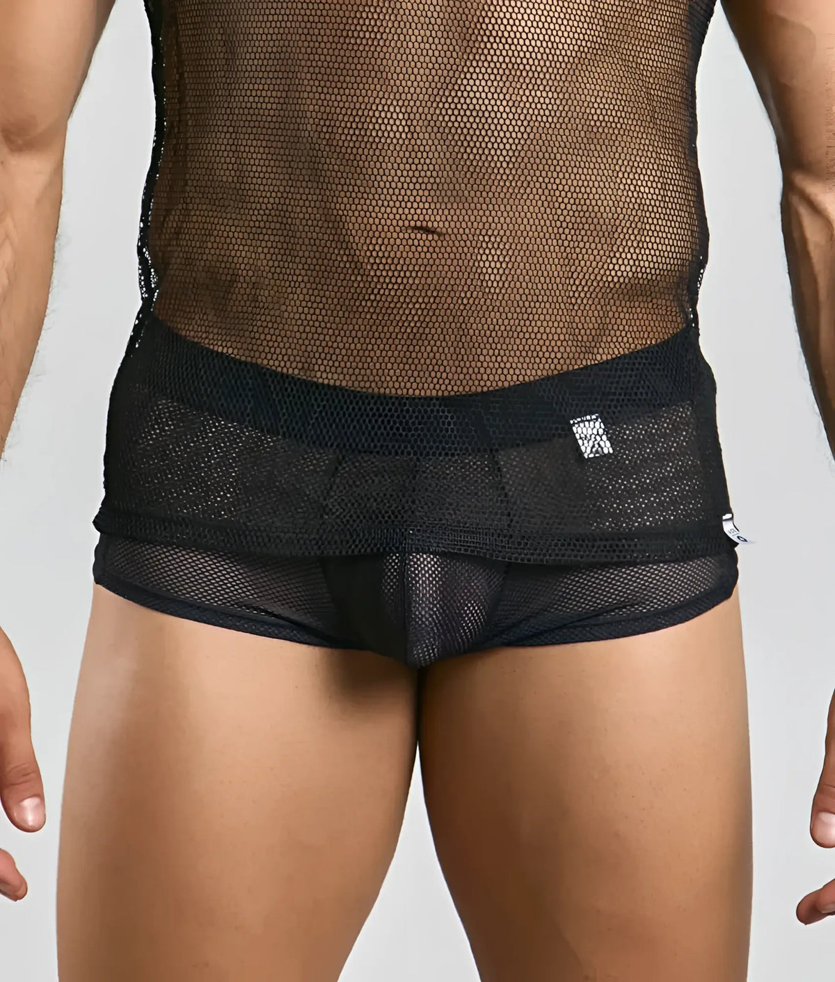 Black mesh briefs with solid black waistband and subtle branding tag complementing the mob fishnet tanktop design