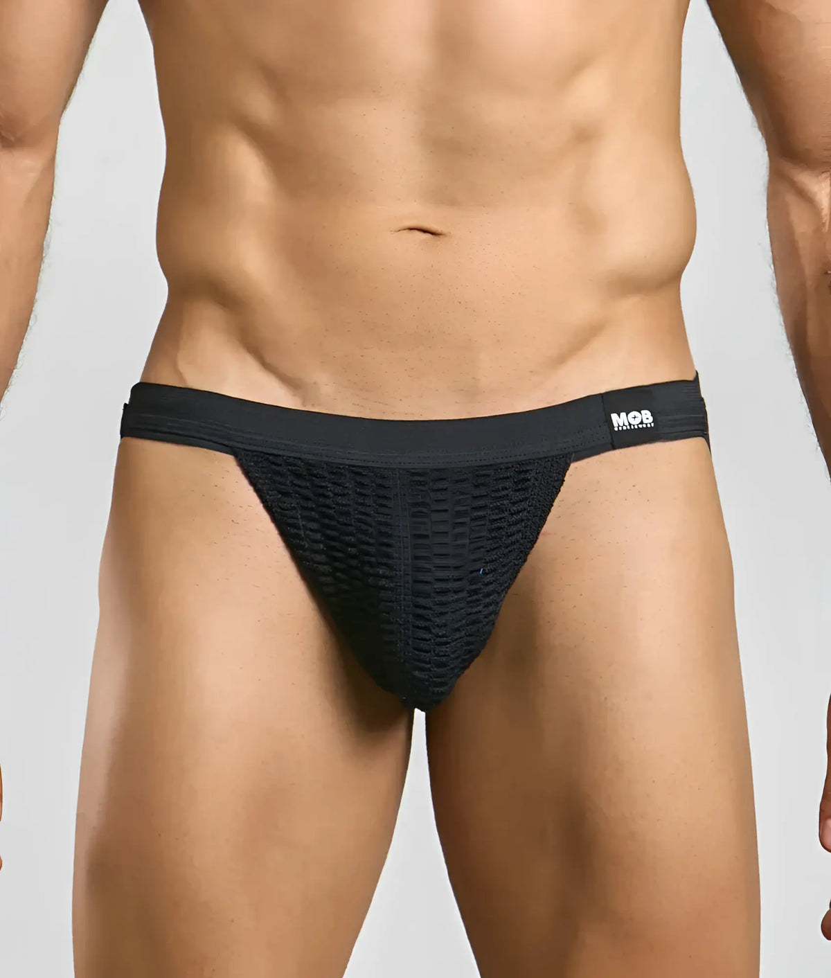 Black mesh mob swim jockstrap briefs with solid waistband featuring mos brand logo for swimwear use