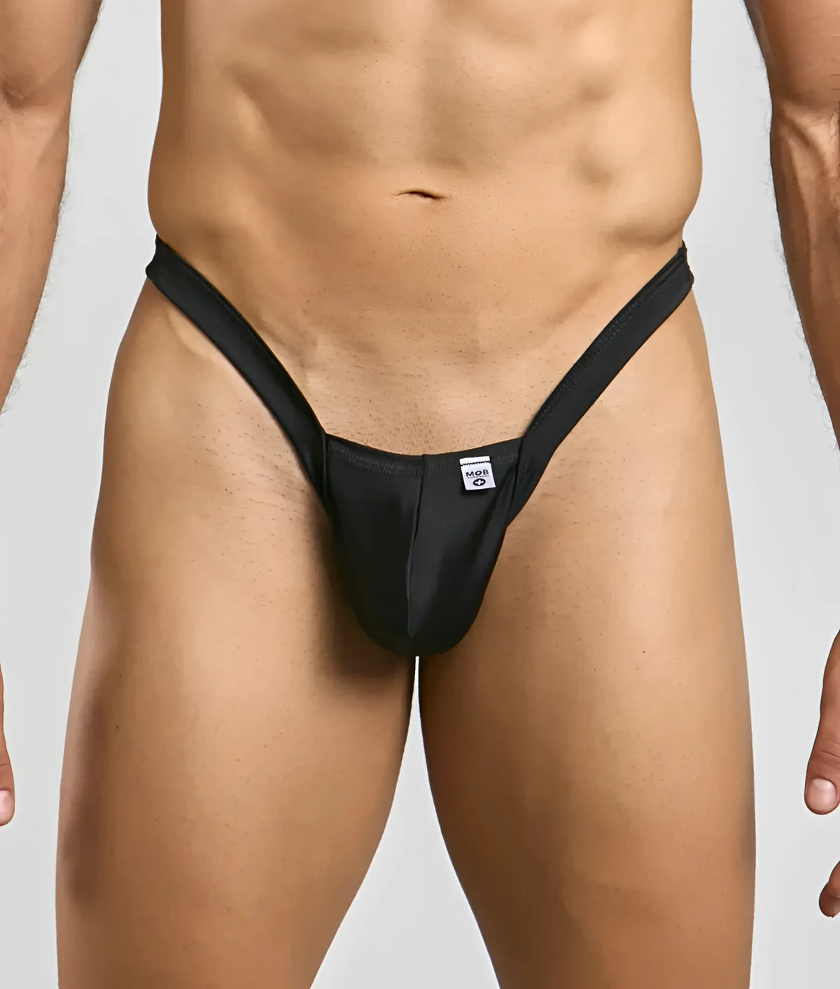 Black mob y buns thong with sleek minimalist design and small white brand tag at the front in form-fitting style