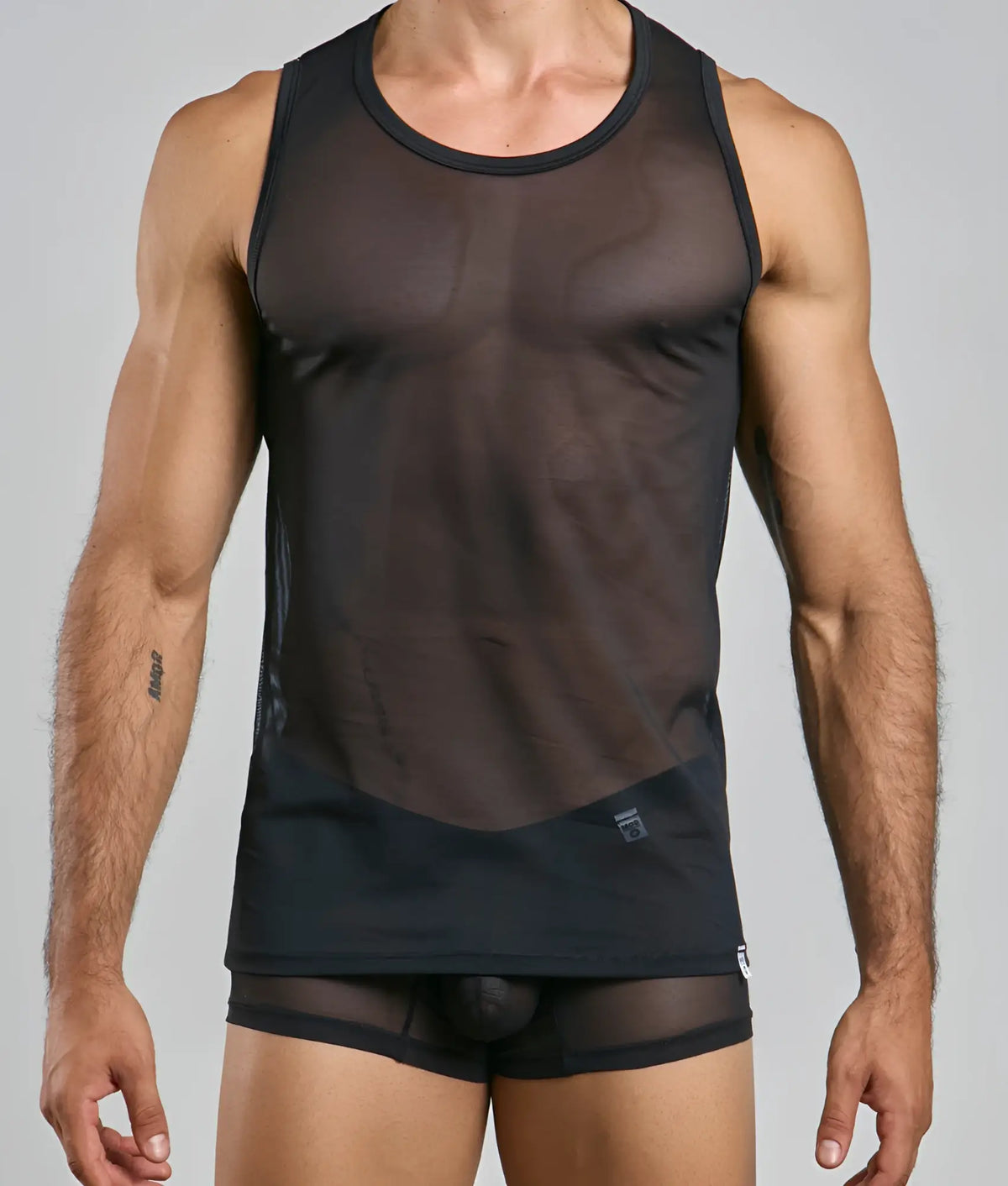 Black sheer mesh tank top with solid black trim and waistband from mob lace tank top collection