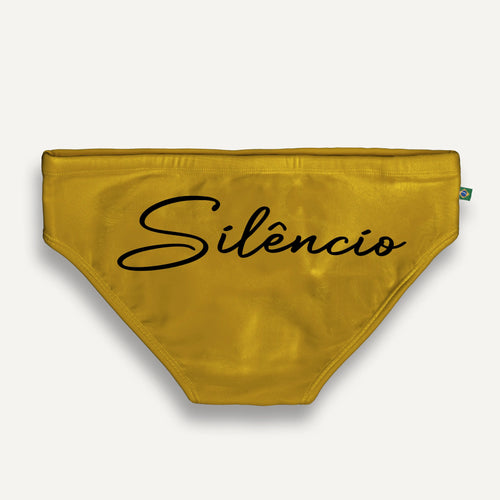 Mustard-colored briefs with large black script lettering.