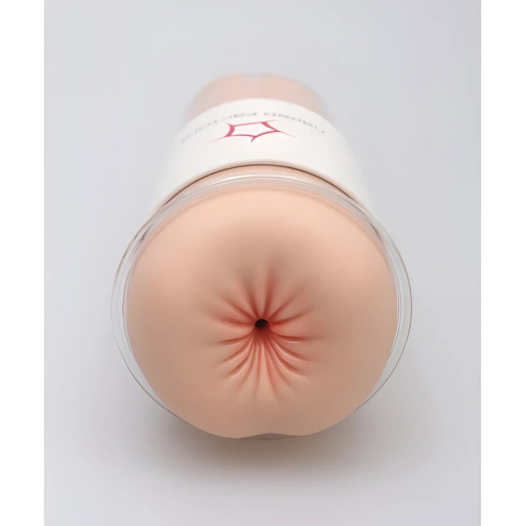 Beige silicone anal plug with clear plastic base and red logo white label from naked factory anal masturbator anna