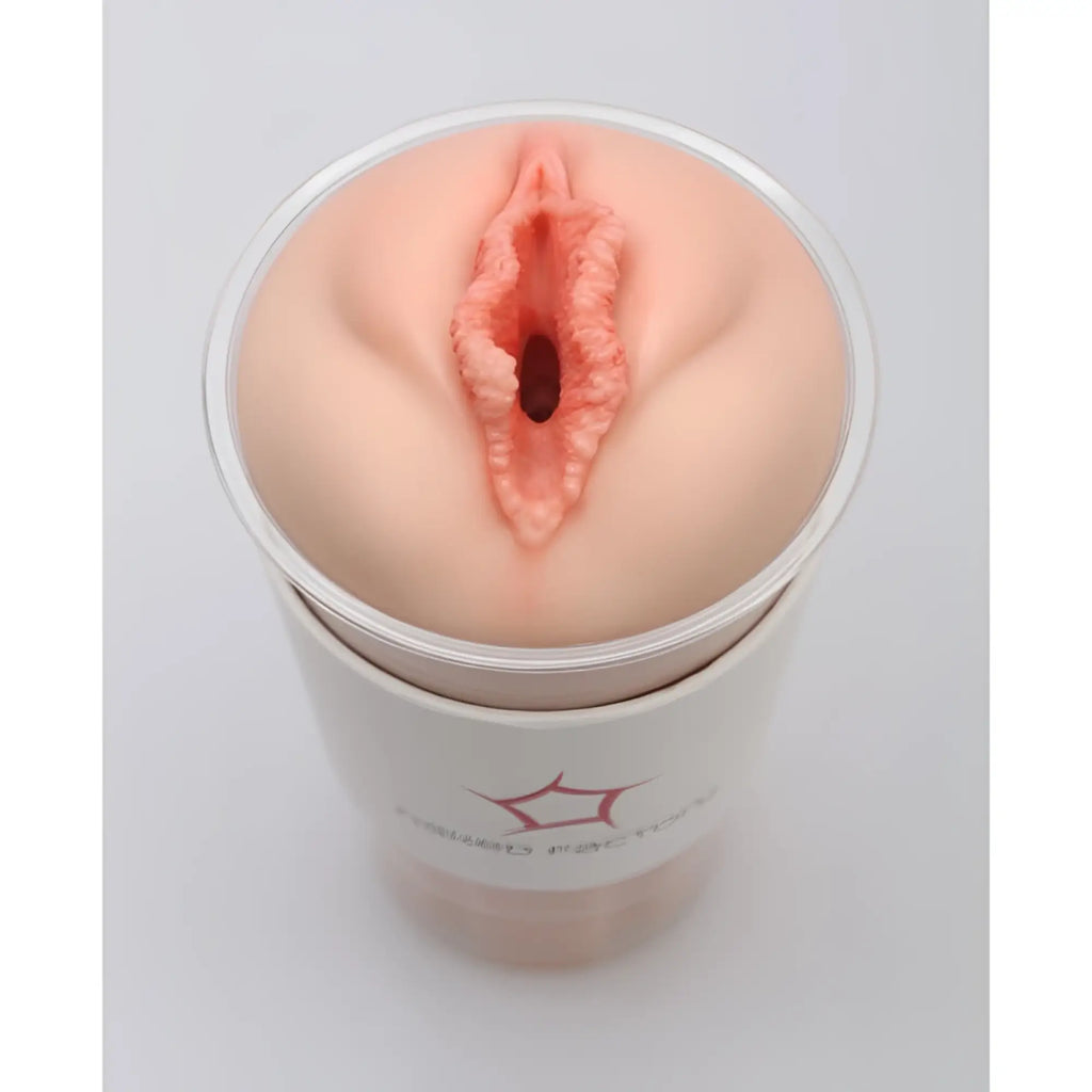 Peach-colored silicone anal plug in clear cylindrical container for naked factory pussy masturbator blair product