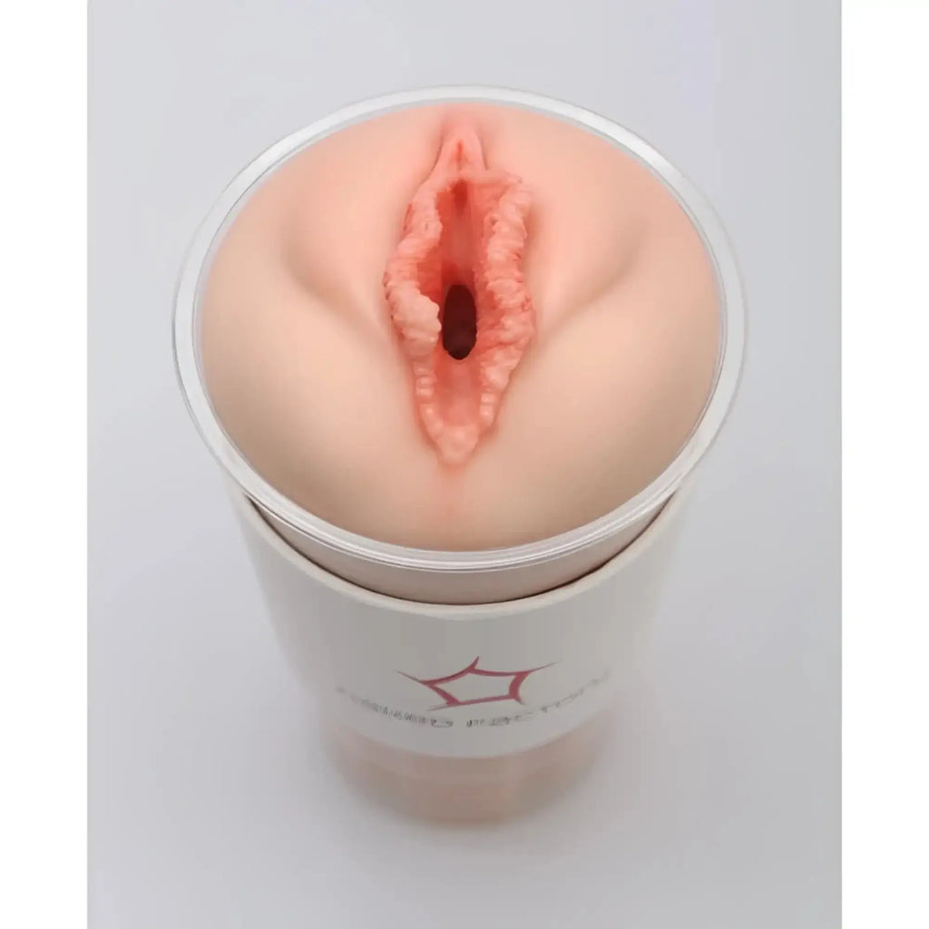 Peach-colored silicone anal plug in clear cylindrical container for naked factory pussy masturbator blair product
