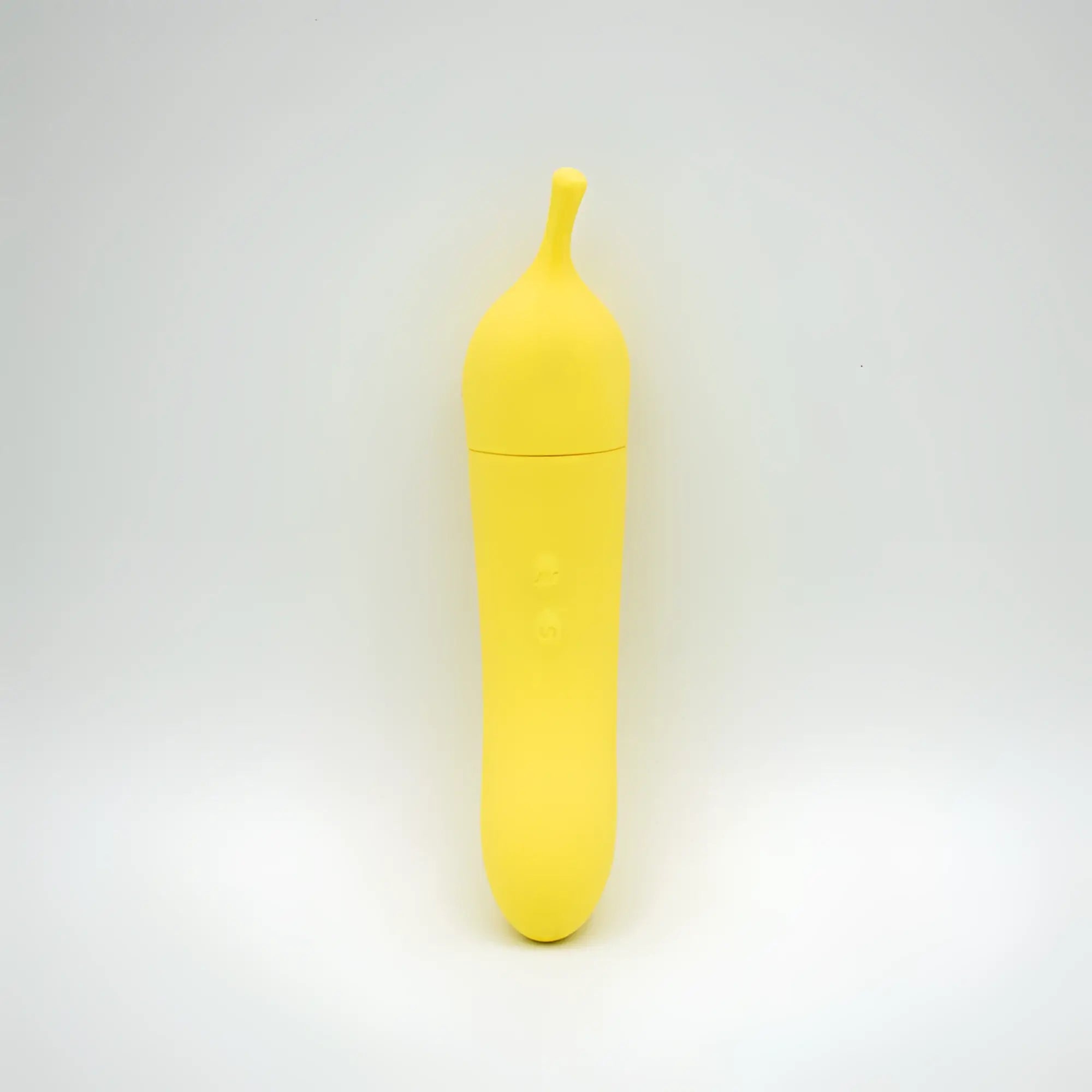 Bright yellow banana-shaped silicone vibrator with smooth rounded design and button indentation from Natalies Toy Box