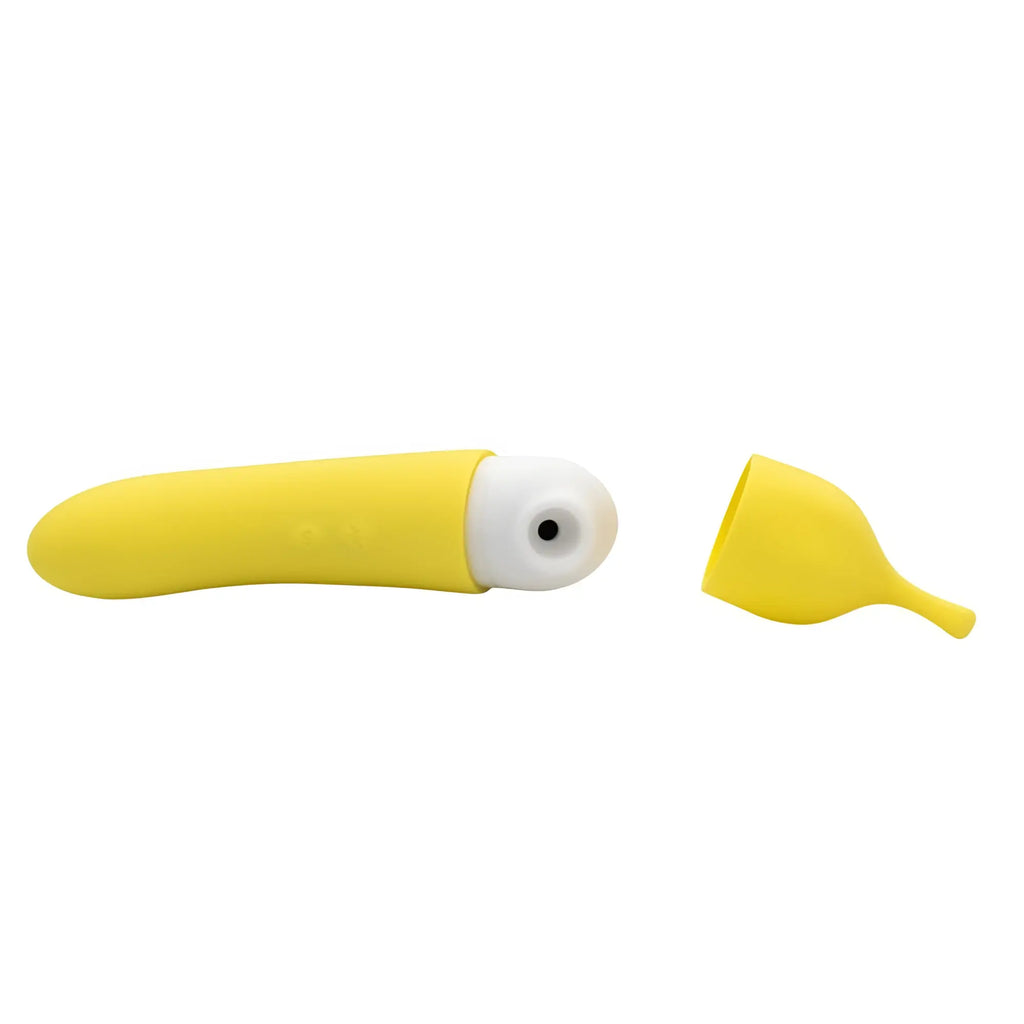 Yellow silicone banana-shaped g-spot vibrator with white tip black detail and matching yellow cap from Natalies toy box