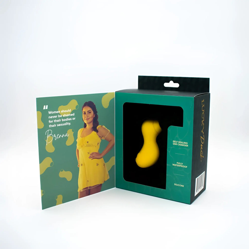 Yellow silicone self-healing usb charger in a green box for natalies toy box lucky duck suction stimulator
