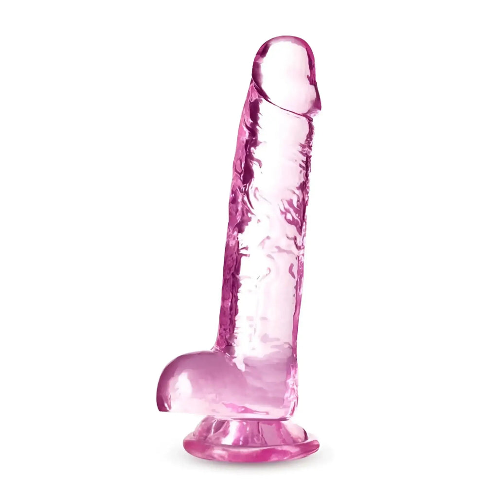 Pink translucent silicone dildo with textured surface and rounded base from naturally yours 7 inch crystalline rose