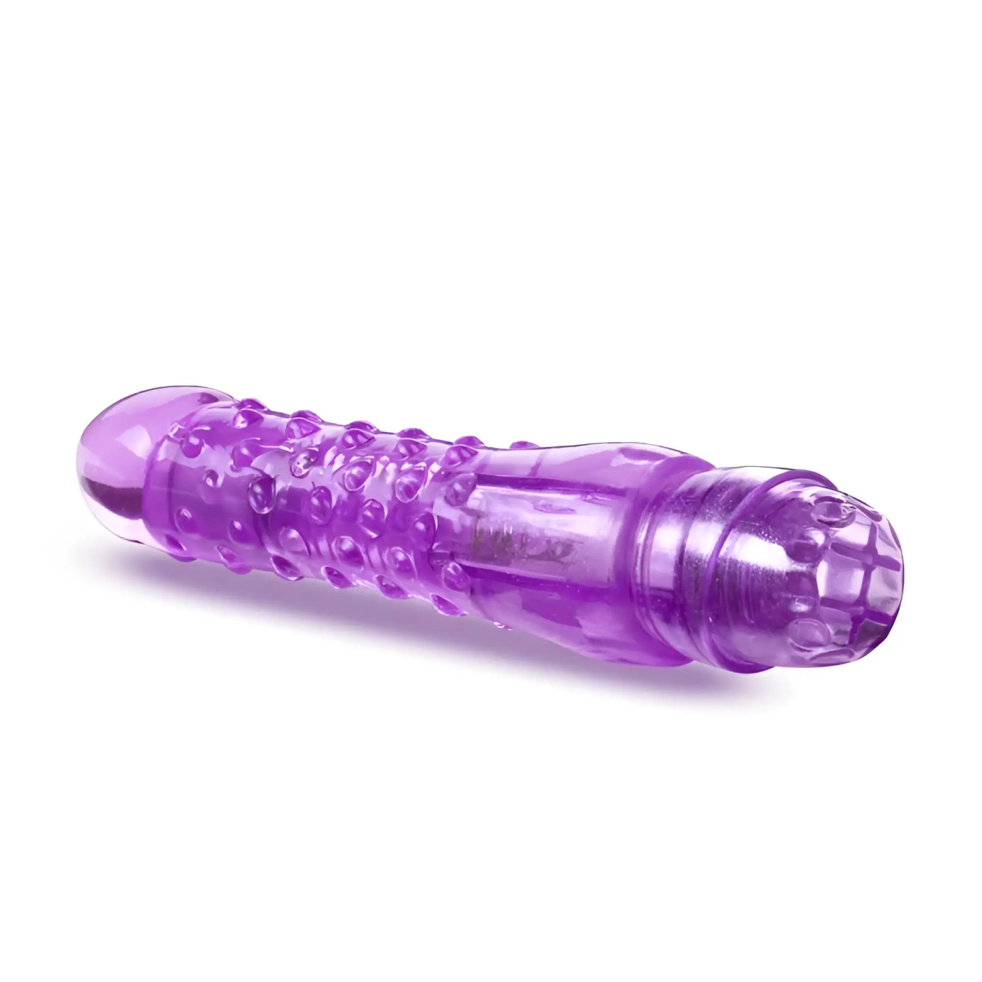 Naturally yours bump n grind purple transparent silicone vibratory toy with textured bumpy surface and rounded ends