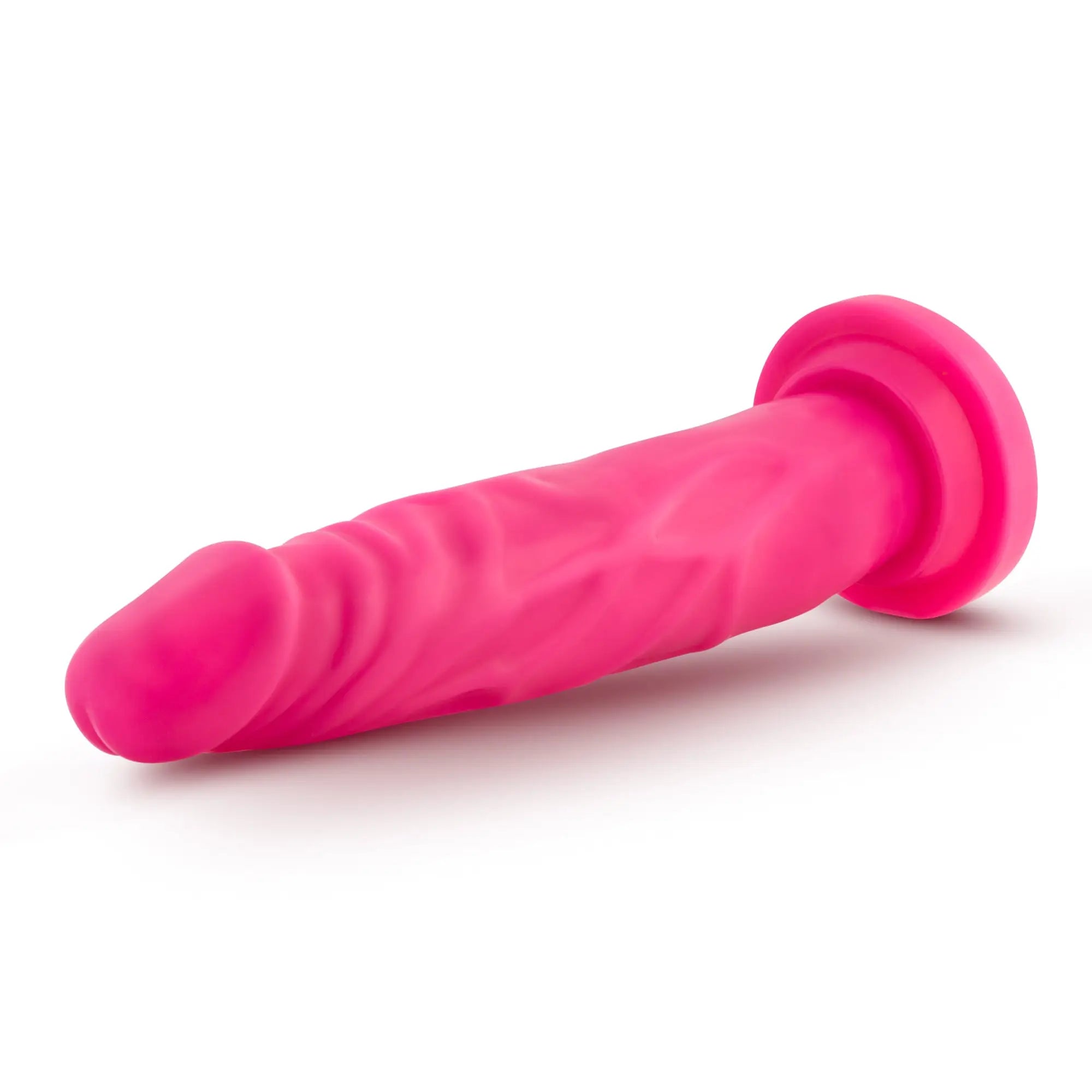 Bright pink silicone anal plug with textured ribbed surface and rounded head from Neo Neo Dual Density Cock 7.5in Neon Pink