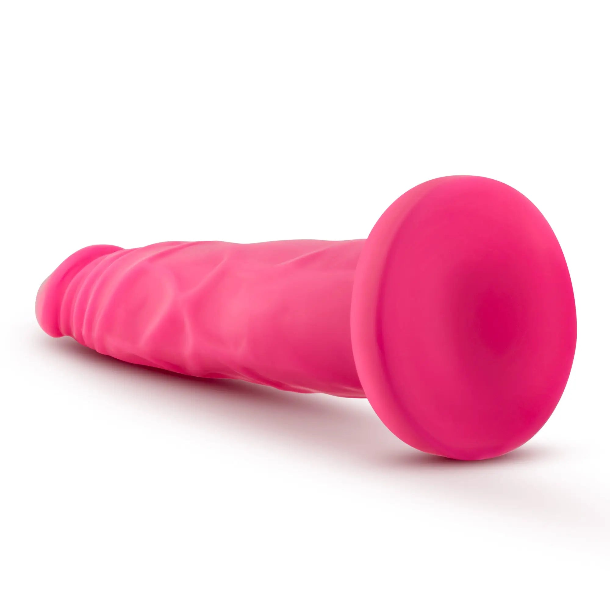 Bright pink silicone anal plug with rounded head and textured body from neo neo dual density cock 7.5in neon pink