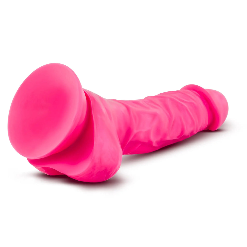 Vibrant pink silicone Neo Neo Dual Density Cock with balls 7in featuring suction cup base and textured surface