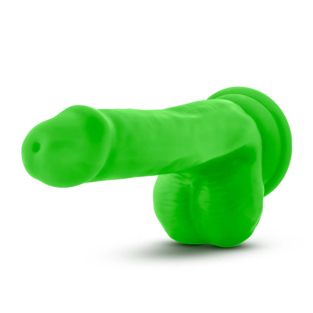 Neo Elite 6in silicone dual density cock with balls in neon green featuring a rounded head and textured base