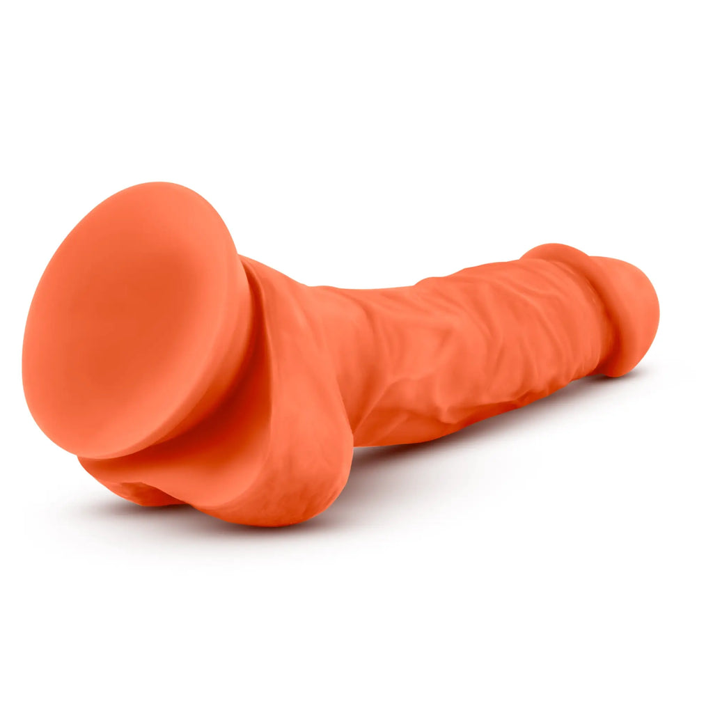 Orange silicone dildo with suction cup base and textured surface neo elite 7.5in dual density cock with balls