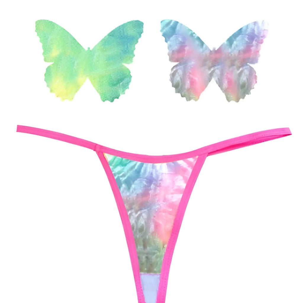 A vibrant pink holographic butterfly print thong with matching butterfly-shaped adhesive patches from neva nude