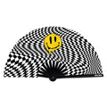 A black and white checkered folding fan with a yellow smiley face design from Neva Nude Trippy Checkers Melty Face series