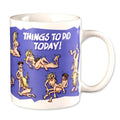 White ceramic novelty coffee mug with blue cartoon design and things to do today text featuring nude figures