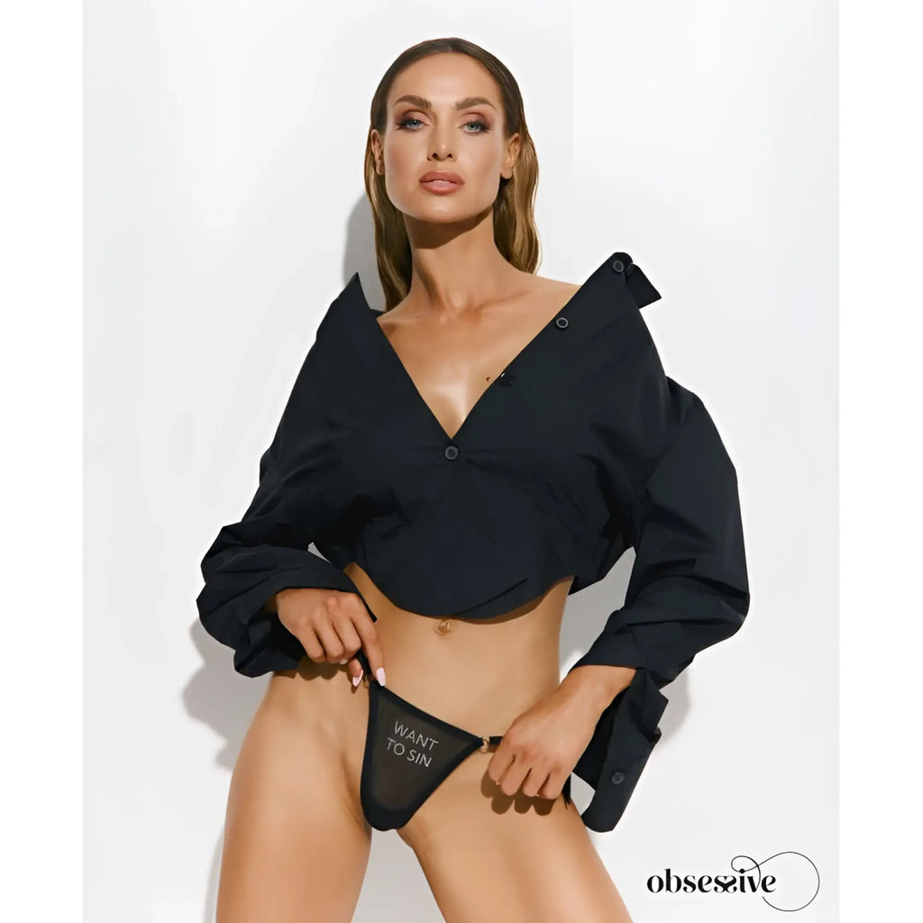Black sheer thong with want to sin embroidered in white text from Obsessive in size S/M back side shown