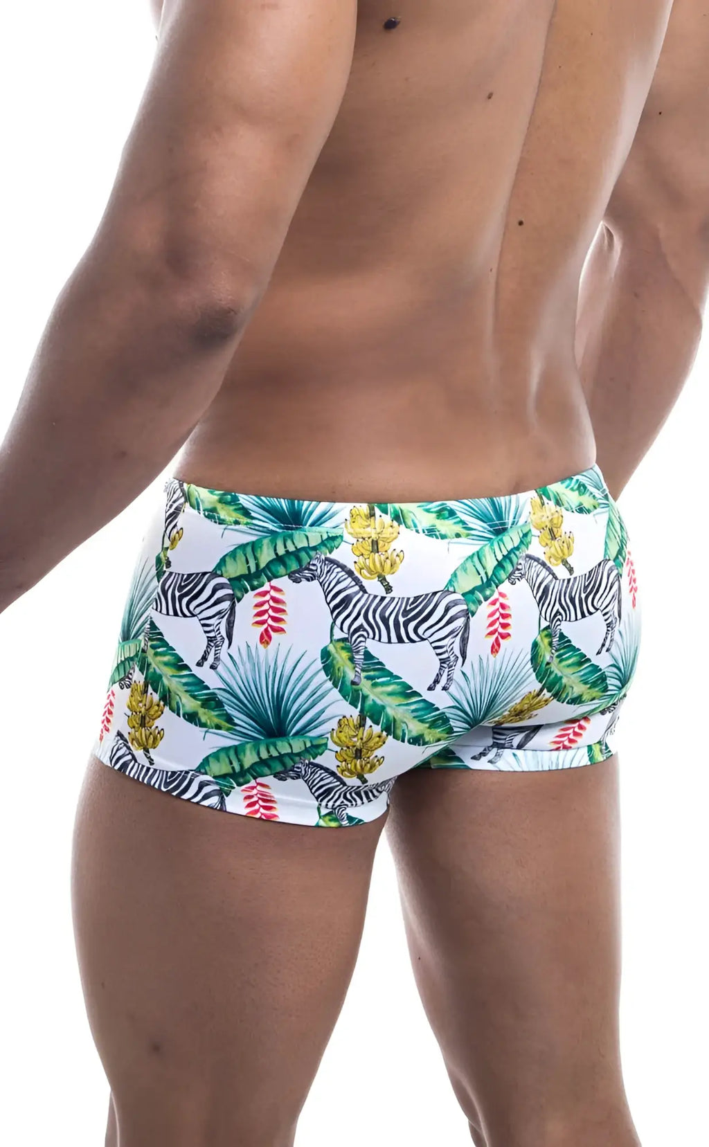 Oceanico square cut white swim trunks with vibrant tropical pattern featuring zebras green palm leaves and red yellow flowers