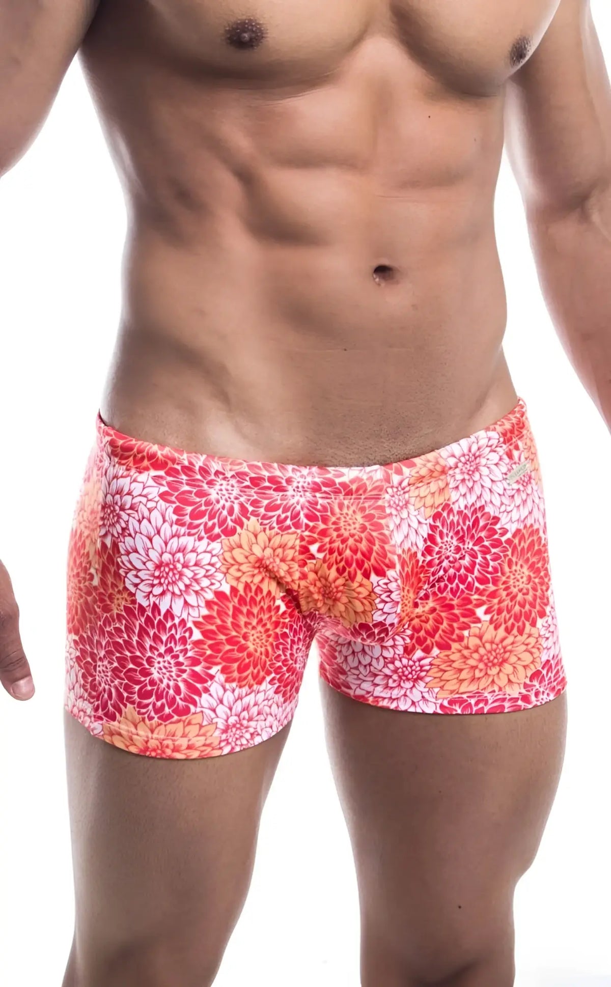 Oceanico square cut swim trunks in vibrant coral and white floral pattern with a snug form-fitting design