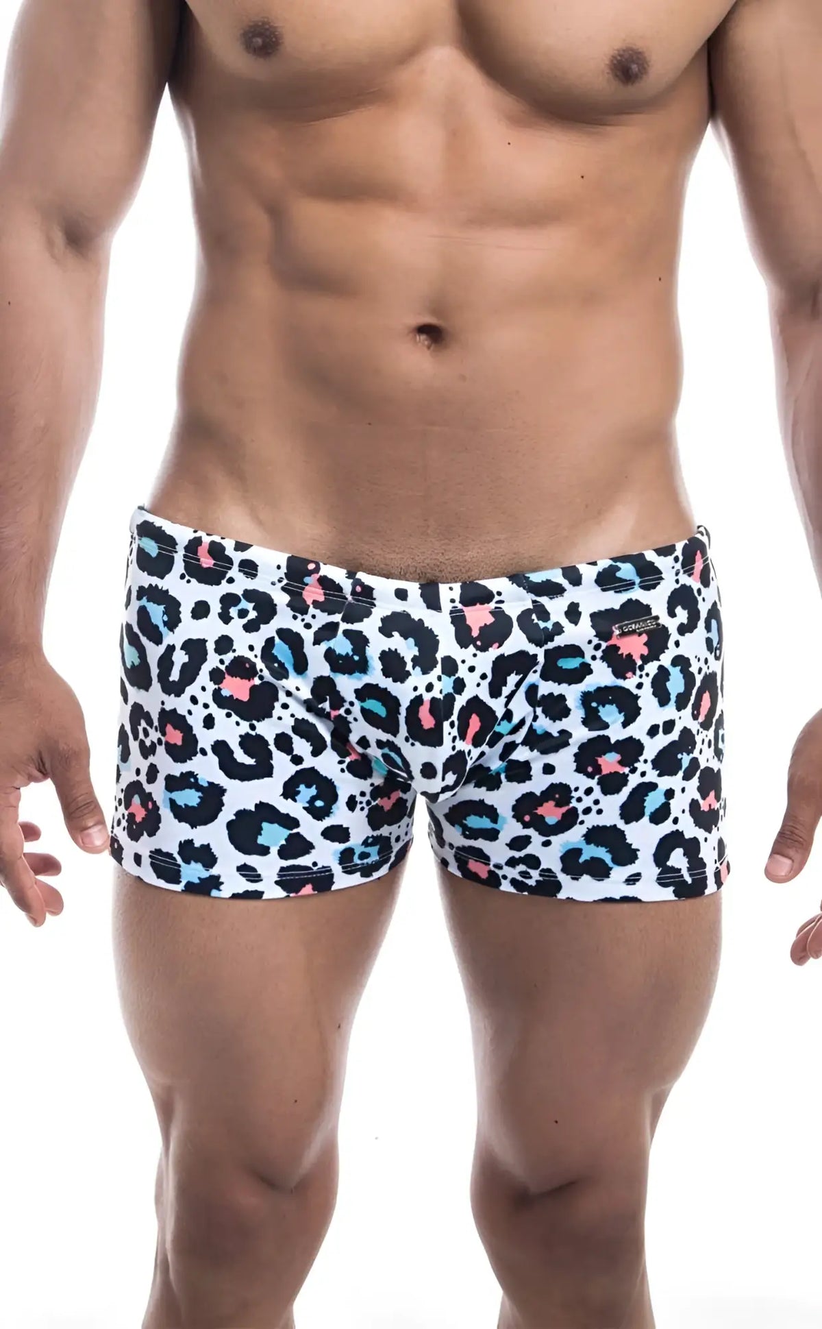 White Oceanico Square Cut swim trunks with bold leopard print in black pink and teal spots