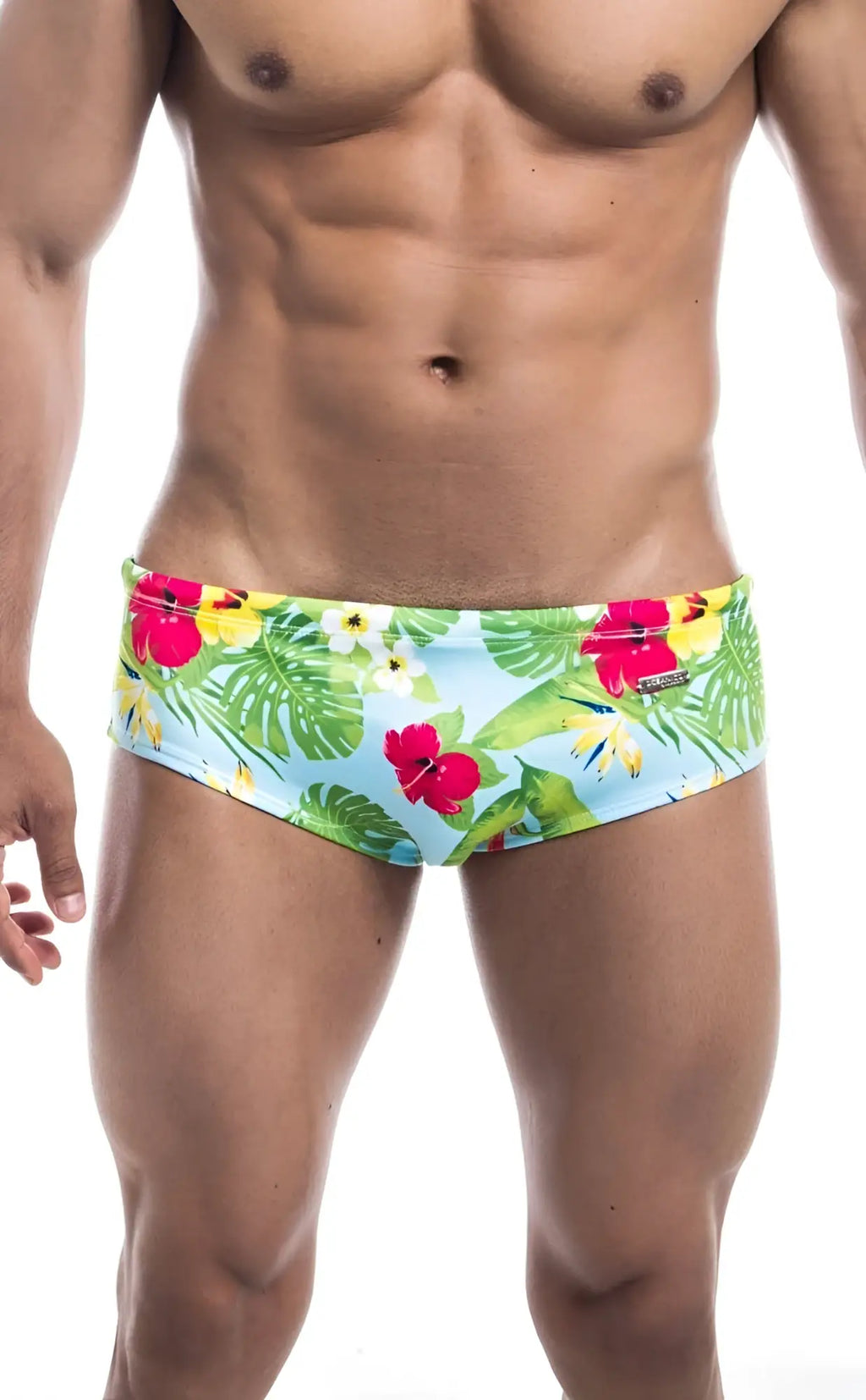Oceanico swim brief brightly colored light blue tropical print with red hibiscus flowers and green monstera leaves