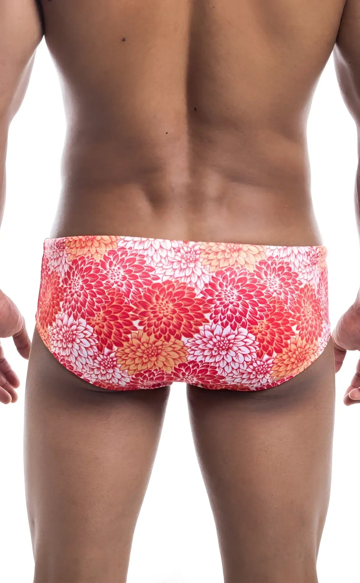 Oceanico swim brief in vibrant red and orange floral-patterned fabric designed for comfortable swimming