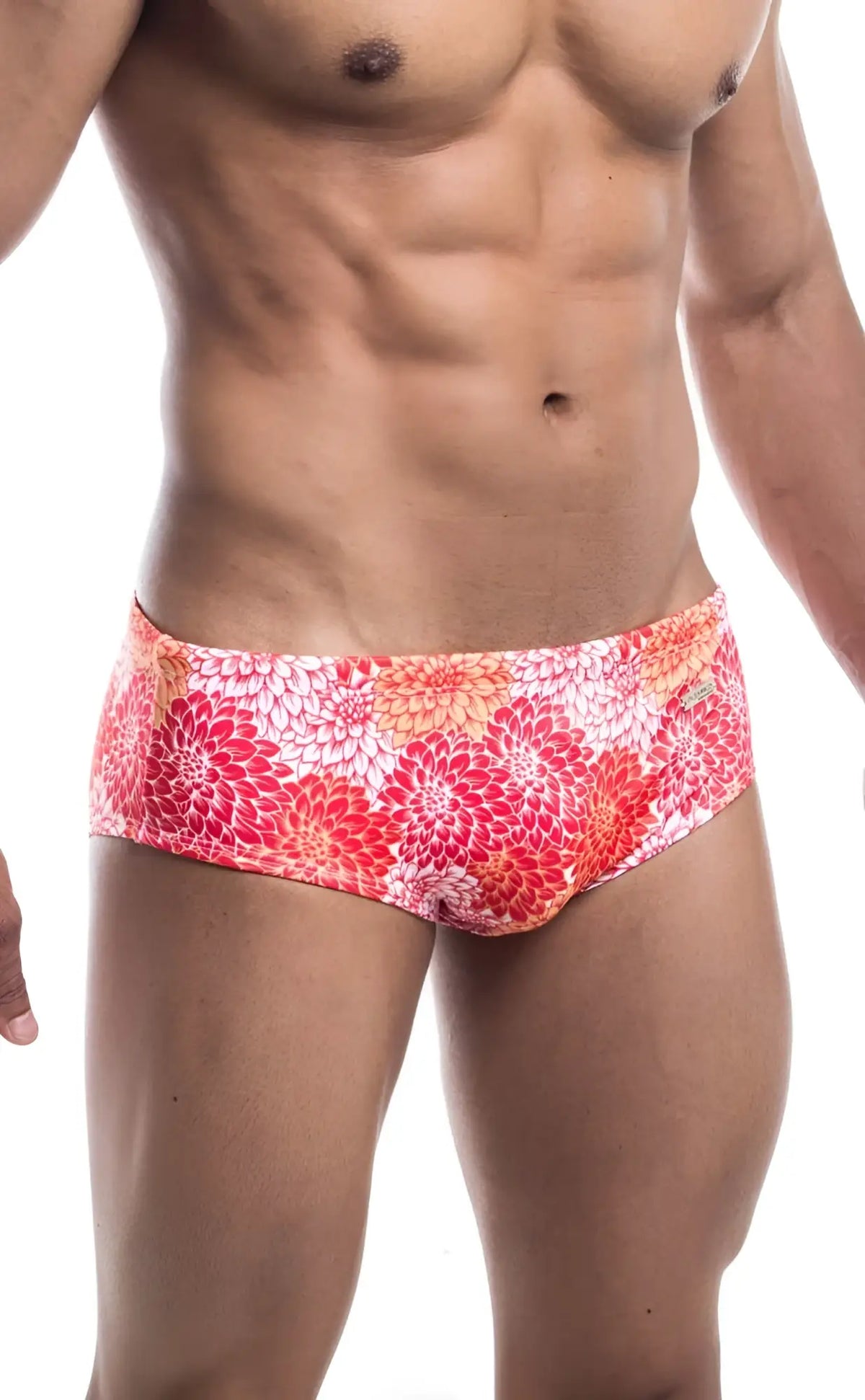 Oceanico swim brief featuring vibrant floral-patterned swim trunks in pink orange and white for beachwear