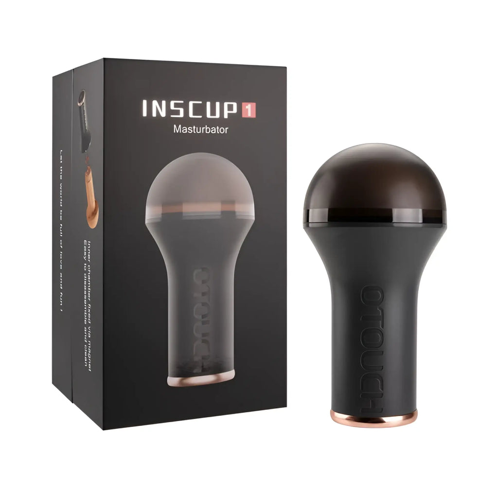 Otouch inscup 1 heating vibration masturbator in black and rose gold with smooth rounded dome top and textured grip
