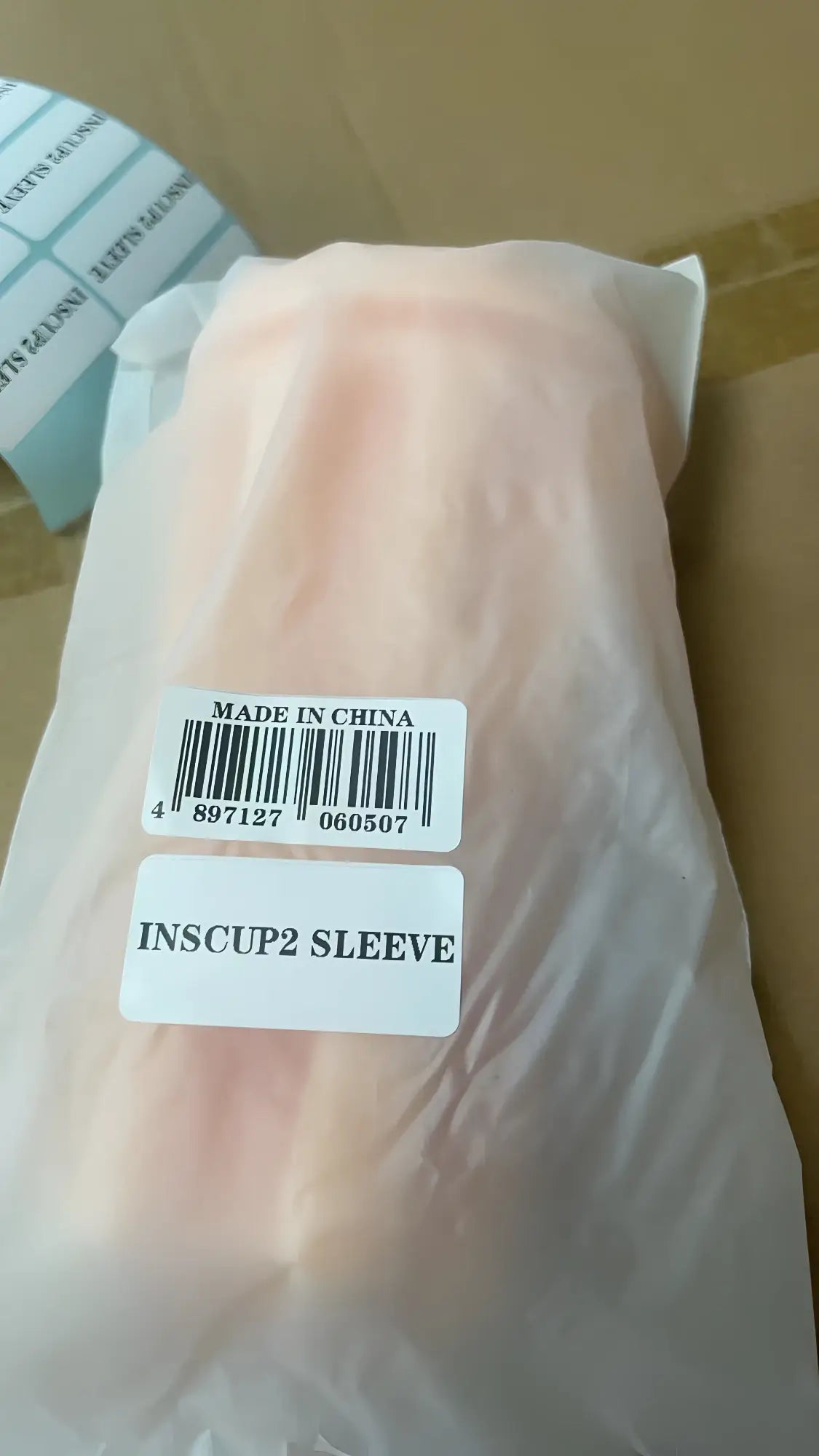 A pale pink translucent plastic inscup2 sleeve made in china for otouch inscup 2 usb masturbator replacement use