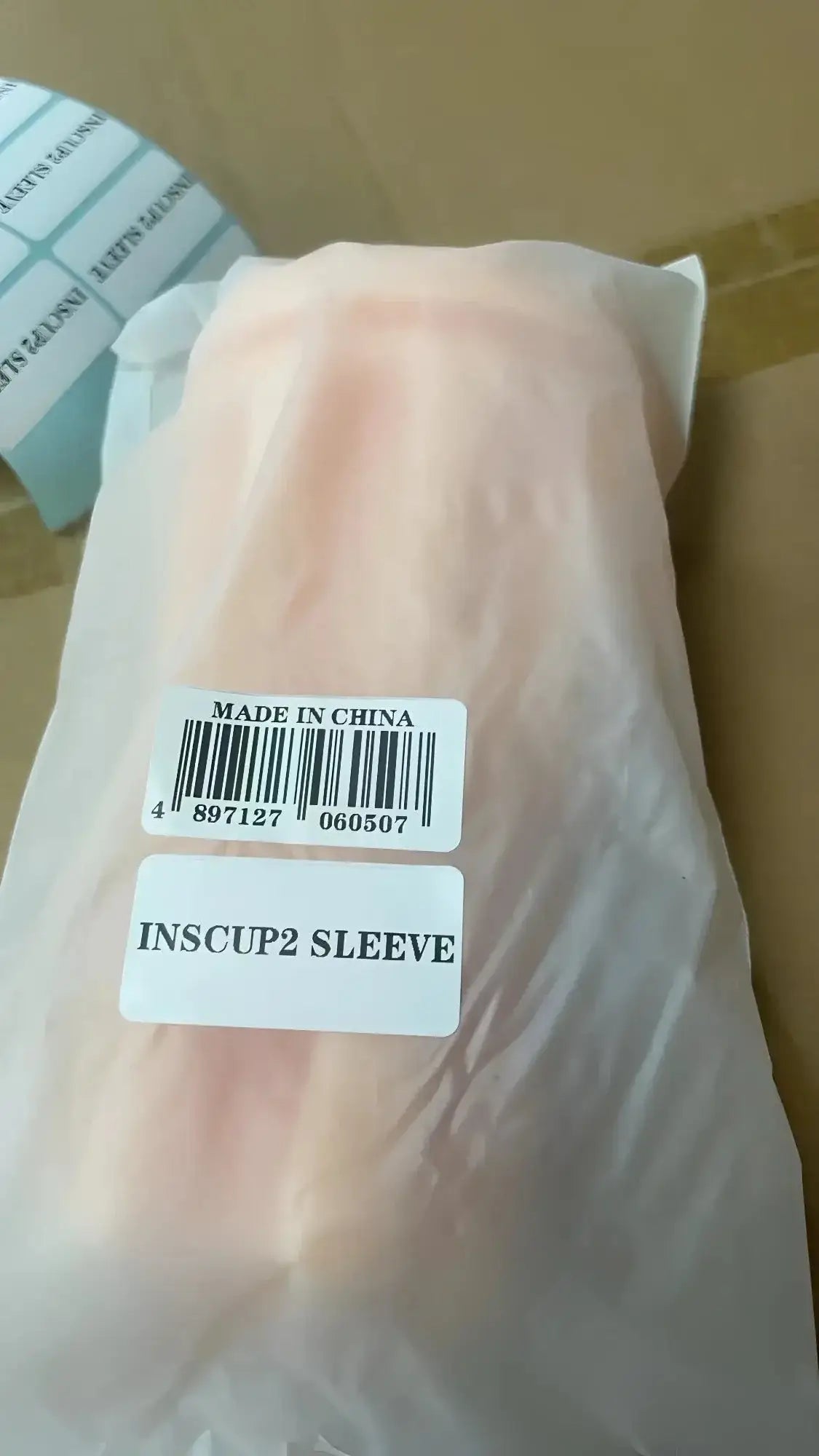 A pale pink translucent plastic inscup2 sleeve made in china for otouch inscup 2 usb masturbator replacement use