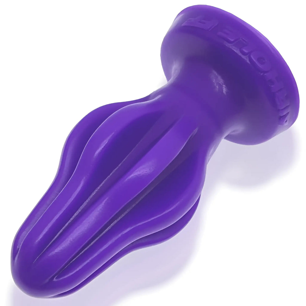 Purple silicone oxballs airhole-2 finned buttplug with tapered fluted design and embossed brand name on the base