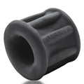 Black silicone anal dilator with embossed oxballs branding from baller centre squeeze ball stretcher night product