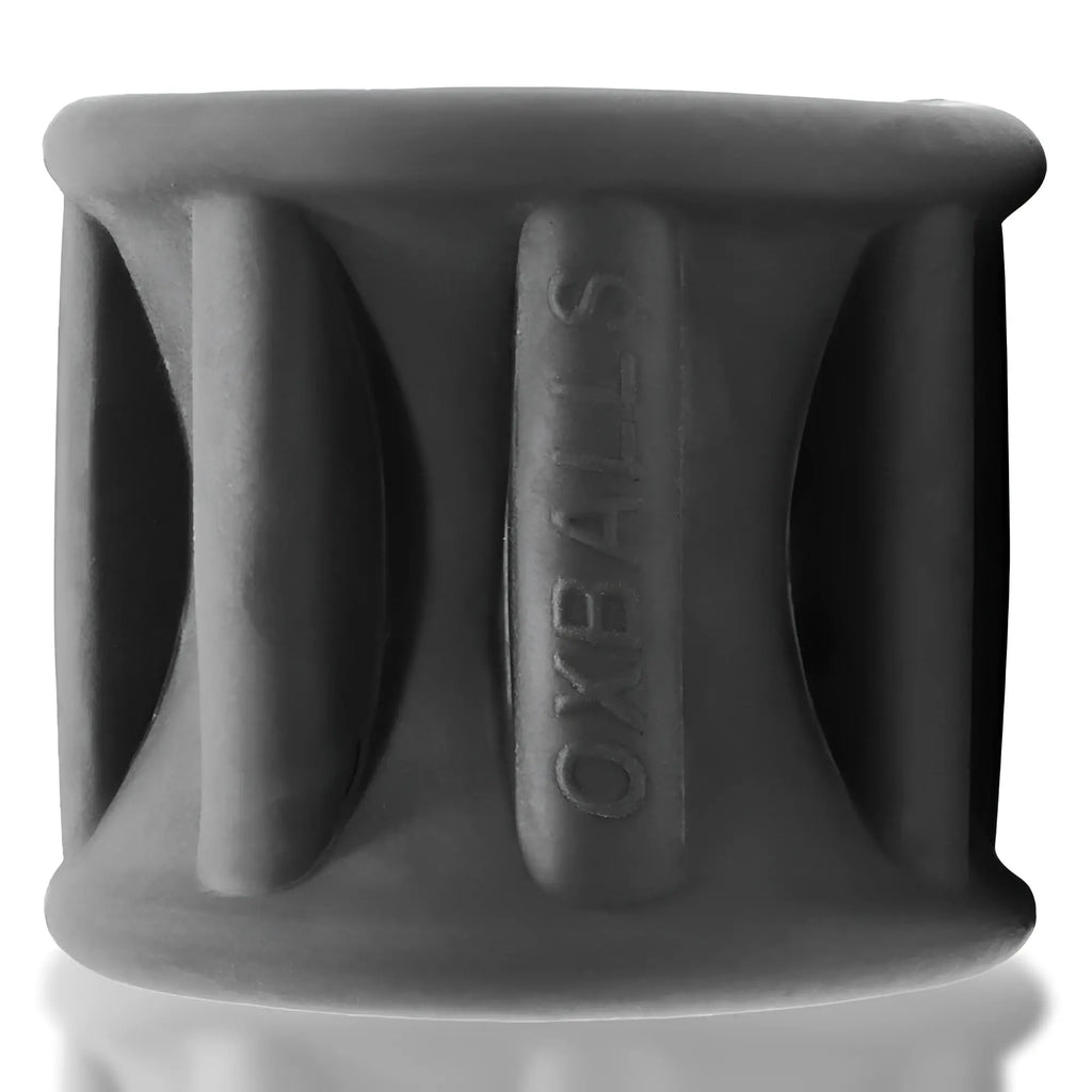 Dark gray silicone oxballs baller centre squeeze ball stretcher with embossed branding and segmented ribbed design