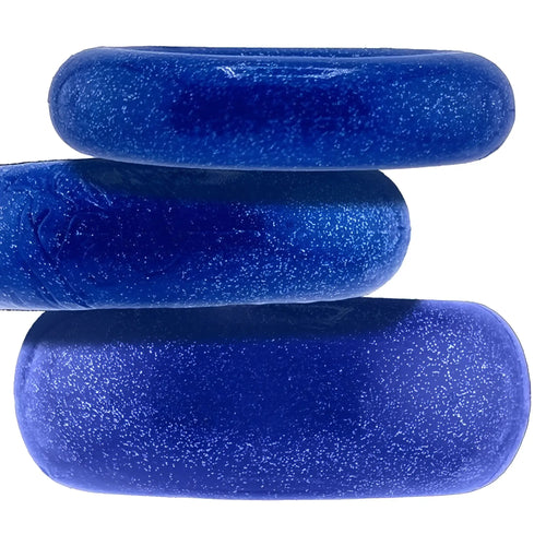 Three stacked glossy royal blue glittery oval soap bars from oxballs cockpack 3 pc ring set blue one size