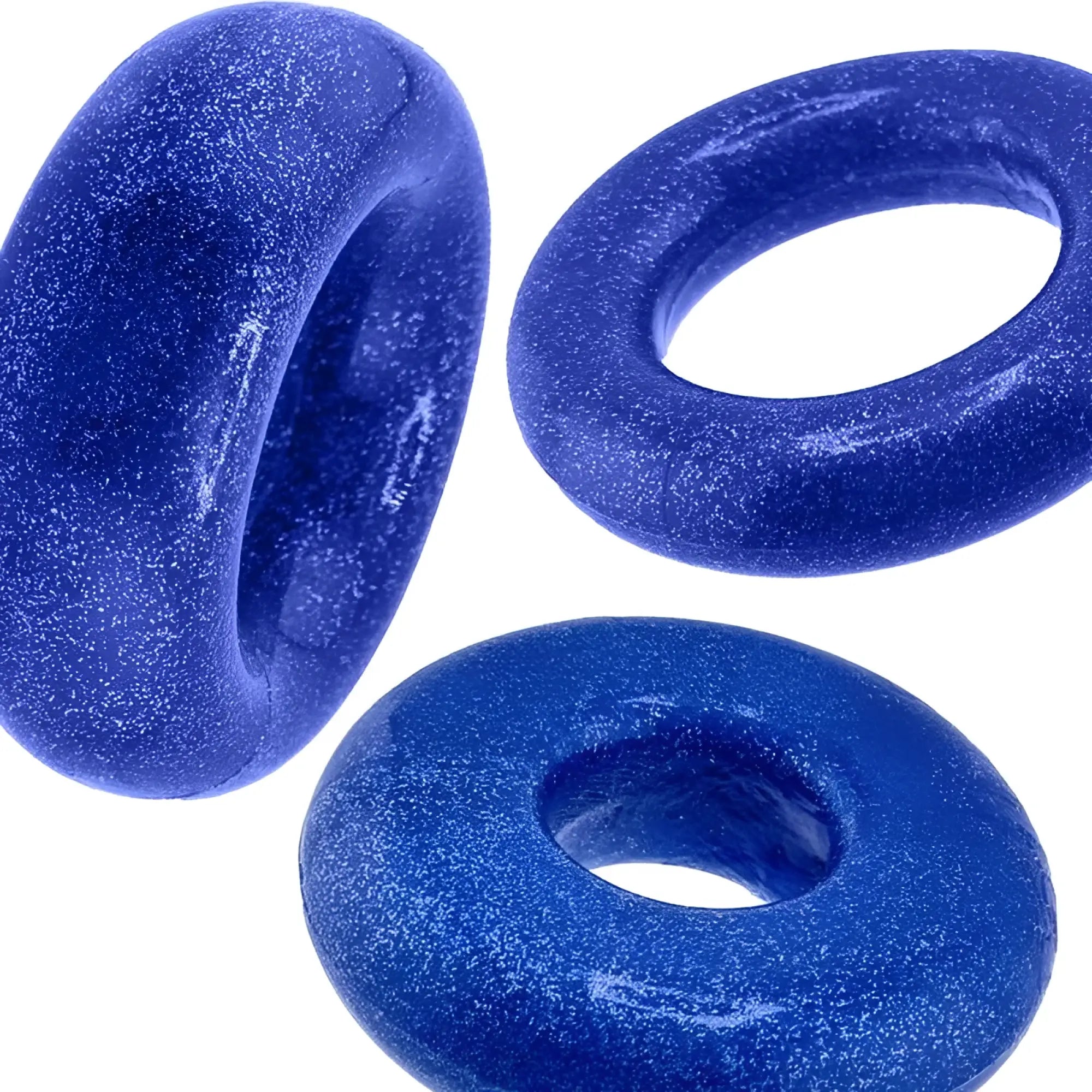 Vibrant blue glittery resin cock rings with a glossy textured surface oxballs cockpack 3 pc ring set one size