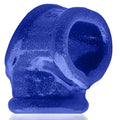 A vibrant blue glittery silicone cocksling fit ring with a textured surface and open center by OxBalls