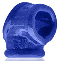 A vibrant blue glittery silicone cocksling fit ring with a textured surface and open center by OxBalls