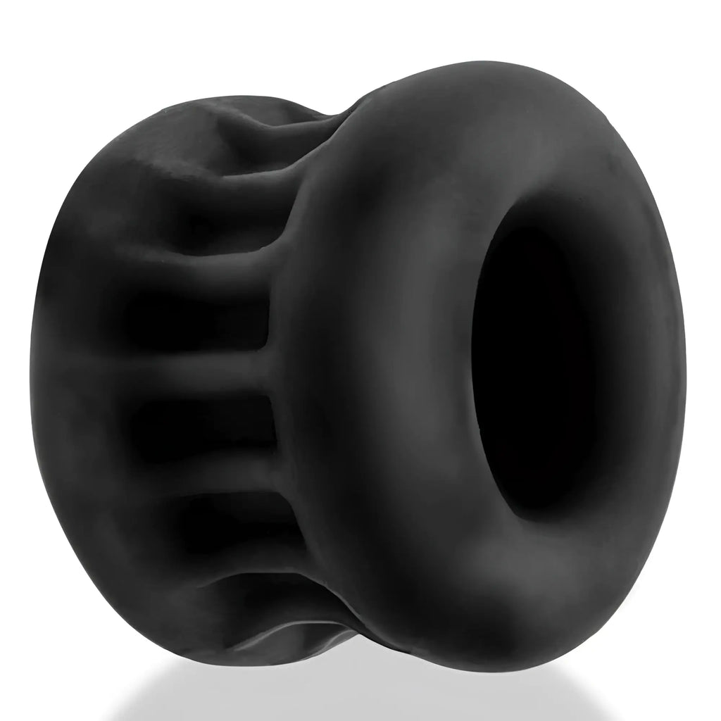 Black silicone anal plug with ribbed texture and smooth rounded edges from oxballs core grip squeeze ball stretcher black ice