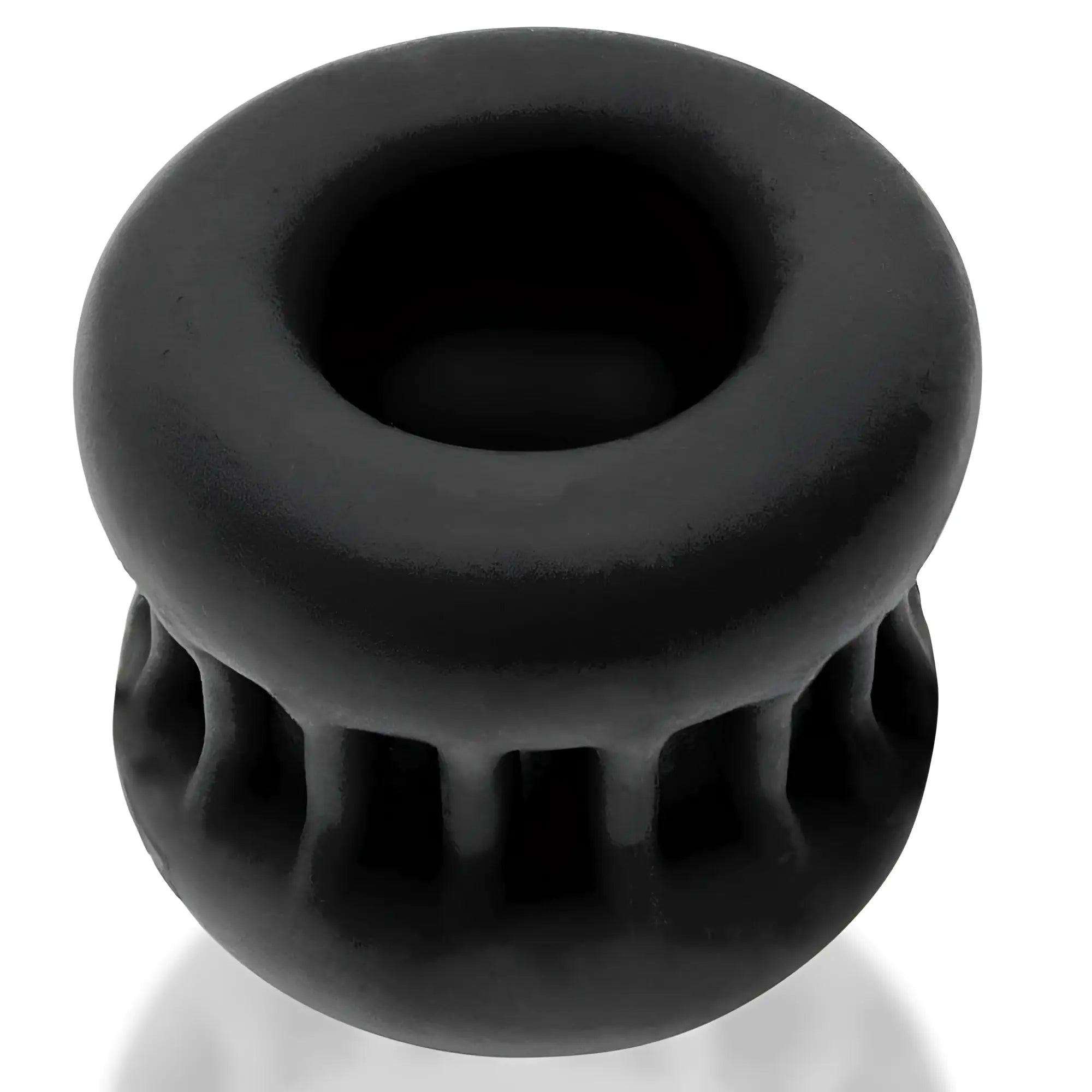 Black silicone OxBalls Core Grip squeeze ball stretcher with textured ribbed lower half and smooth upper surface