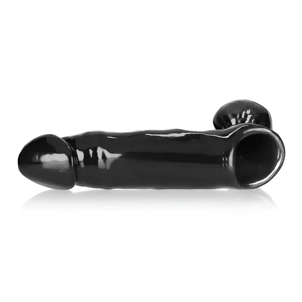 Black glossy silicone anal plug with rounded head and tapered end by oxballs daddy cocksheath w balls one size
