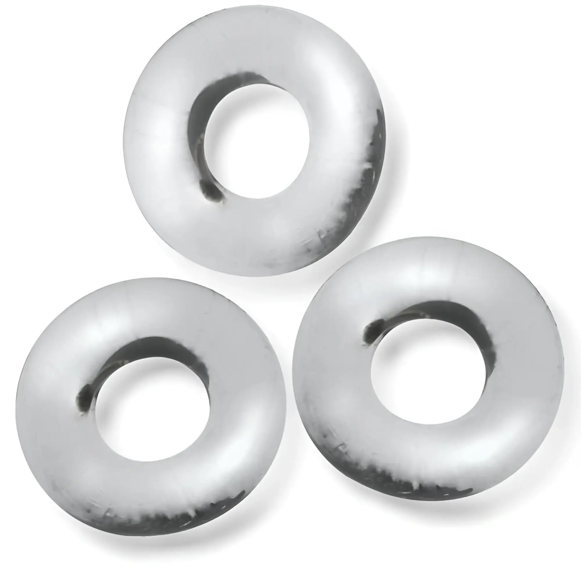 Three shiny silver metal oxballs fat willy jumbo cockrings with smooth reflective surfaces and slightly worn edges