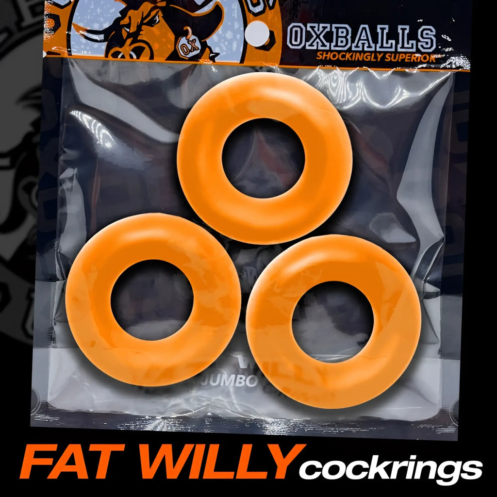 Three bright orange glossy plastic cockrings in clear package labeled fat willy cockrings by oxballs jumbo size