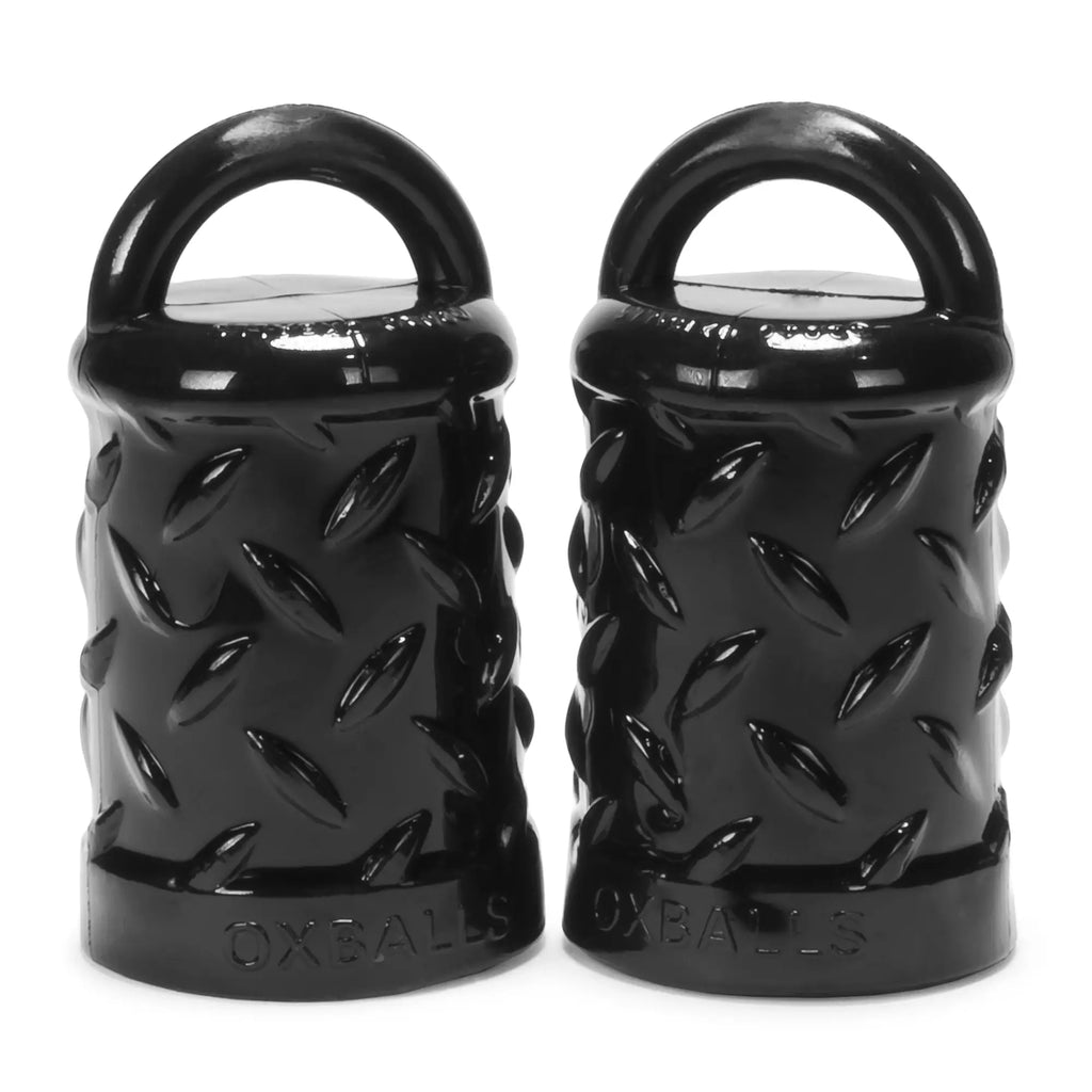 Black oxballs gripper nipple puller weight plates with diamond texture and integrated handles for easy use