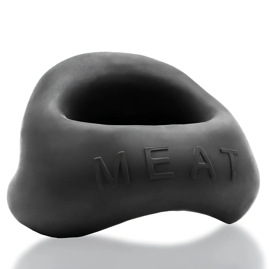 Black matte silicone meat-shaped oxballs meat big bulge cock ring with embossed lettering visible on front side