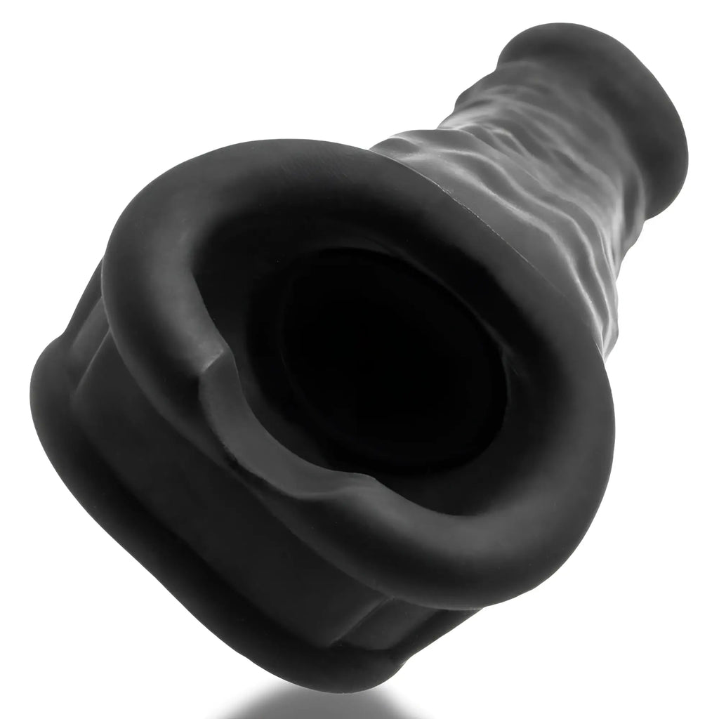 Black silicone anal plug with flared textured base and tapered neck from oxballs muscle ripped velvet-smooth night