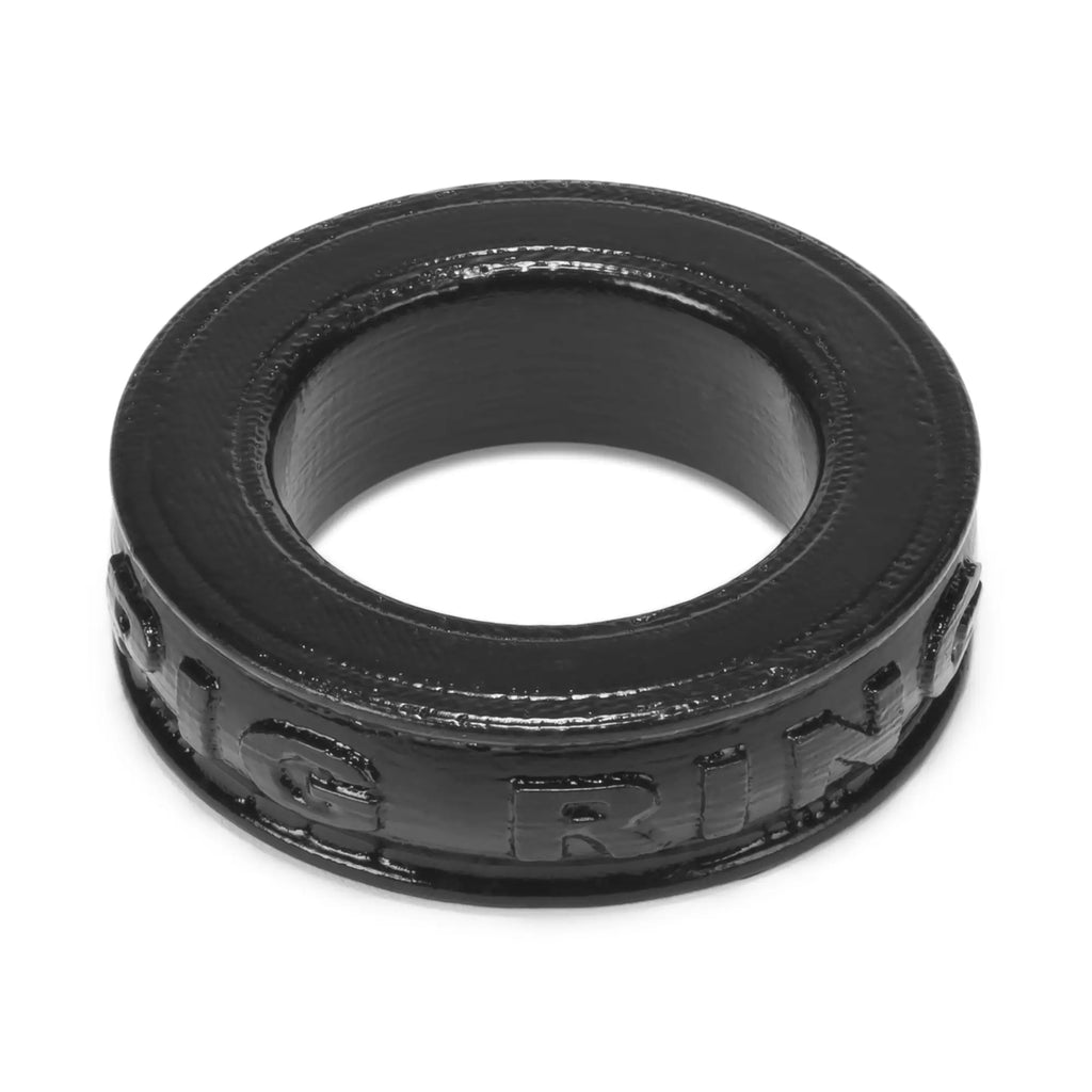Black rubber OxBalls pig ring cockring with embossed grin lettering designed for comfortable wear