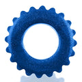 A vibrant blue glittery oxballs plushy ring with a serrated edge and central hole in one size