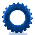 A vibrant blue glittery oxballs plushy ring with a serrated edge and central hole in one size