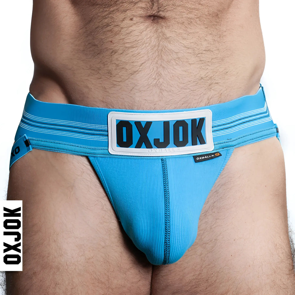 Bright blue oxballs slingjock upthrust slider-strap jock briefs with white label and black lettering in xl